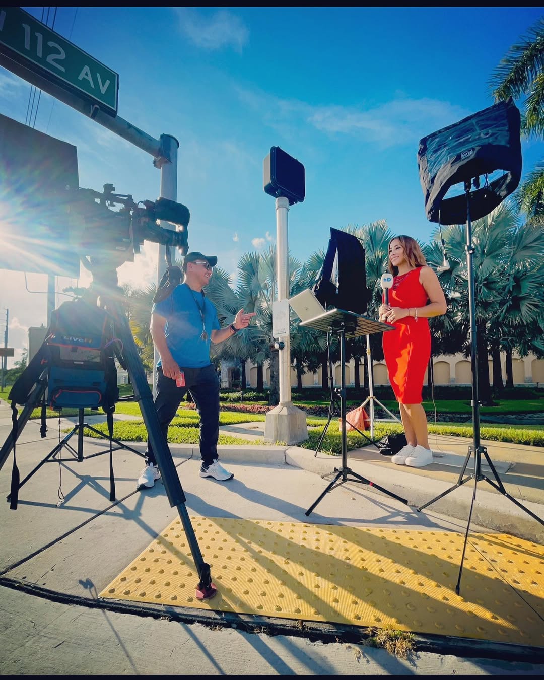 Reporter on street with camera crew